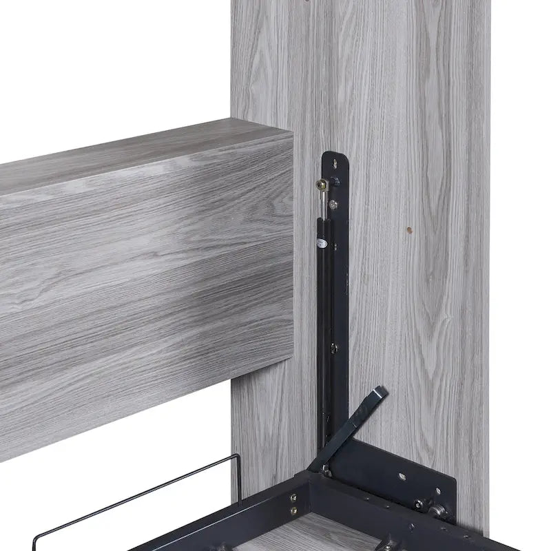 Le lit escamotable en bois peut être replié dans une armoire